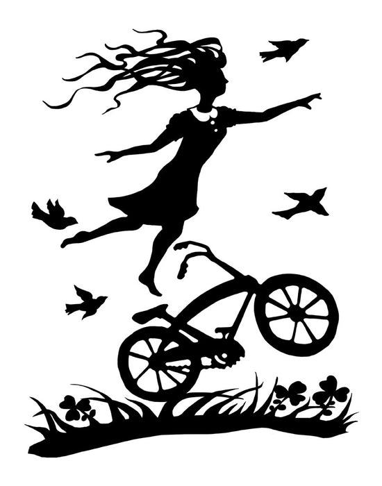 A girl standing on a bicycle.